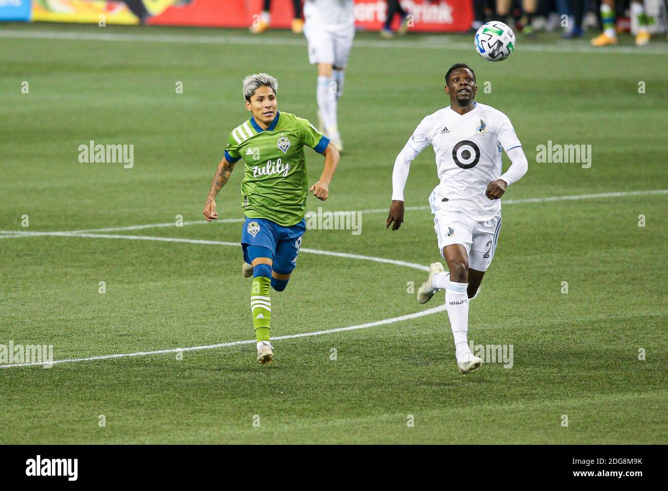 Seattle Sounders forward Raul Ruidiaz (9) and Minnesota United defender Bakaye Dibassy (21) chase after the ball during the second half of the MLS Wes Stock Photo