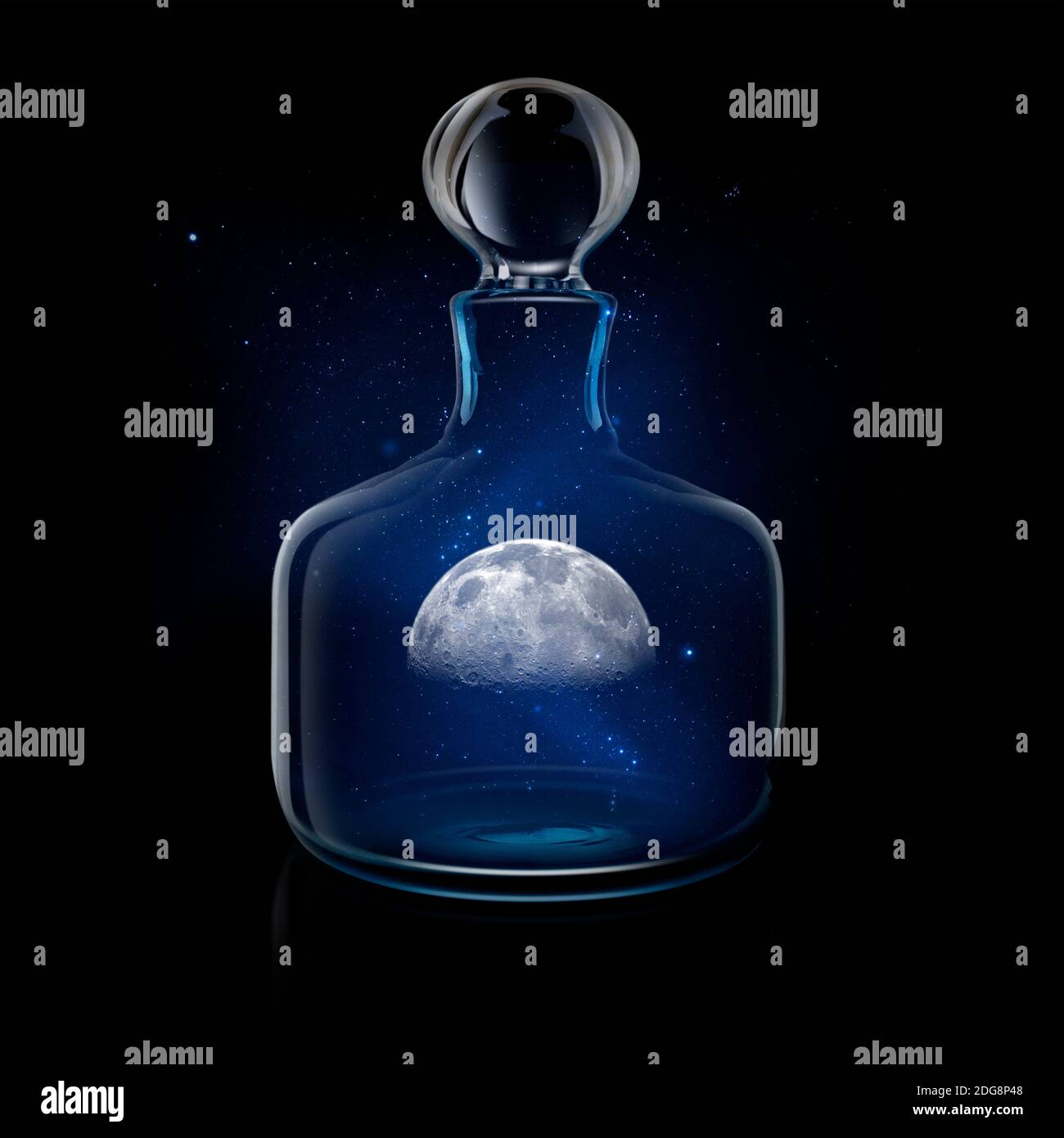Mysterious moon in glass decanter against night sky Stock Photo
