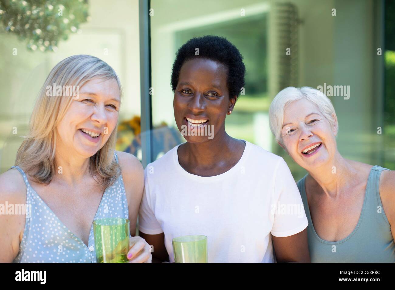 Portrait beautiful happy senior women on patio Stock Photo - Alamy