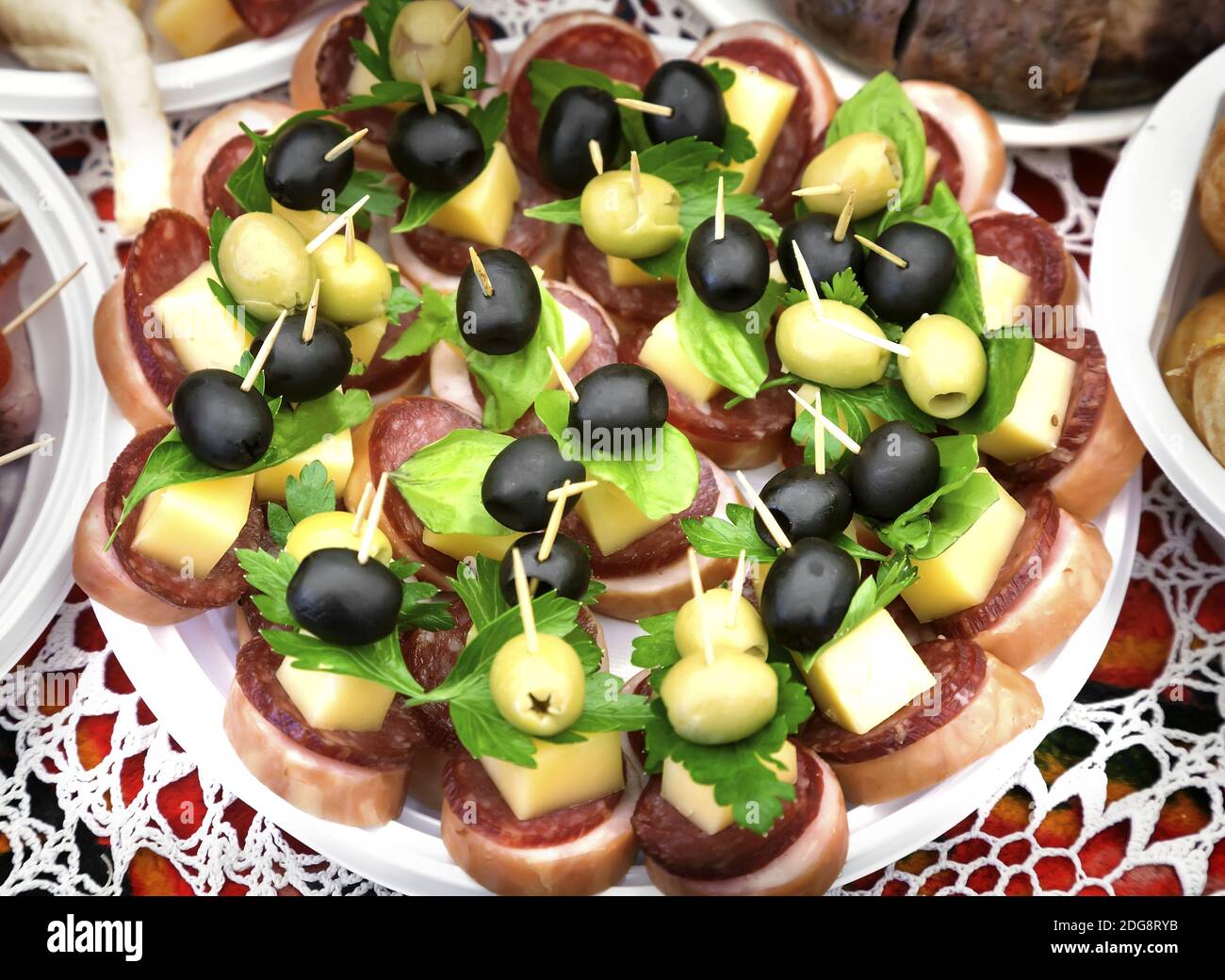 Sandwiches with cheese, sausage and olives. Stock Photo