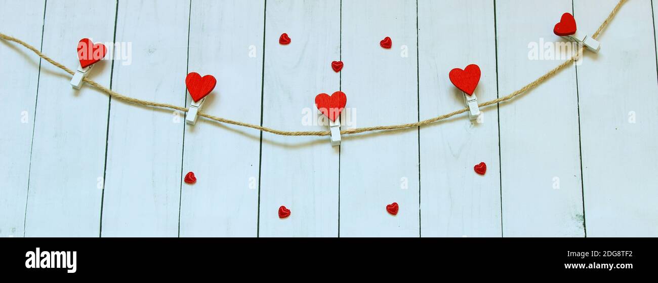 Red heart on a wooden background. Love story. Concept for a greeting card. Stock Photo