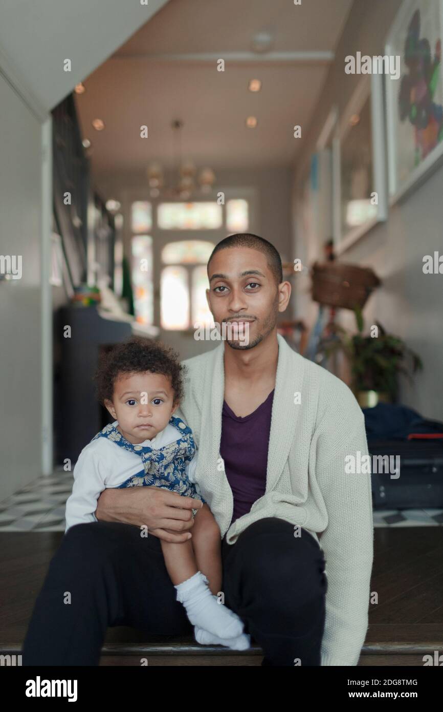 Portrait father and baby daughter at home Stock Photo