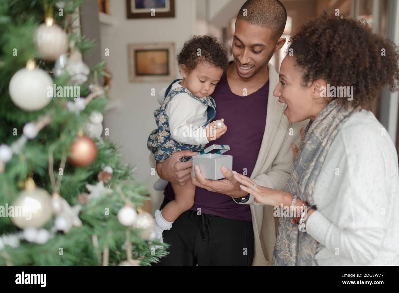 Mother helping baby stand hi-res stock photography and images - Alamy