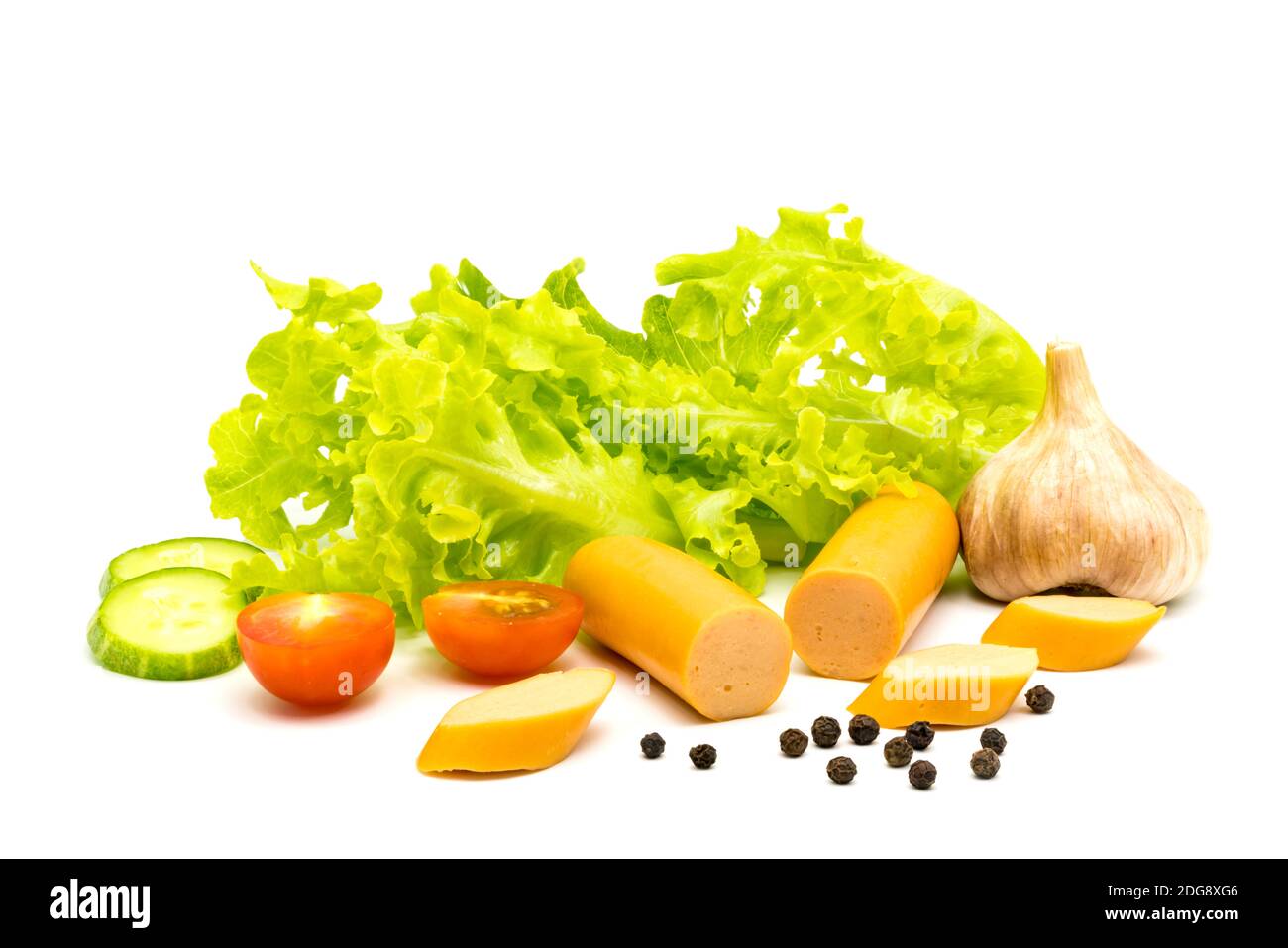 Sausages, garlic, lettuce, pieces of cucumber, black peppers and tomatoes Stock Photo