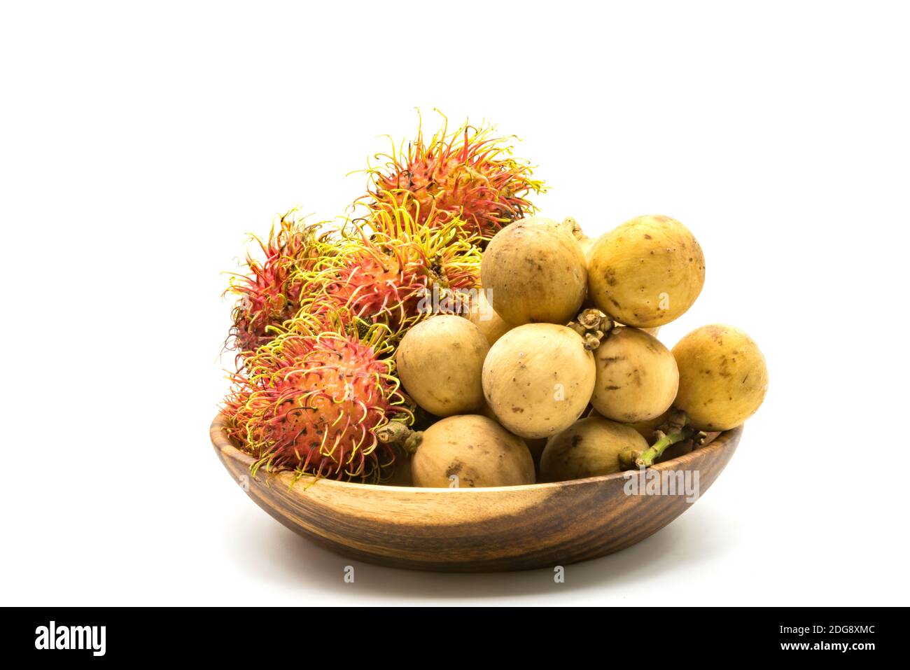 Fresh Rambutans and Longkongs in a wooden bowl Stock Photo