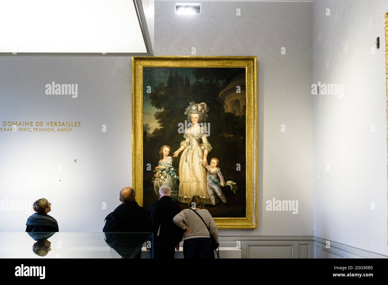 PARI, FRANCE - Jun 02, 2017: People looking at Marie Antoinette painting in Versailles Palace, Paris, France, beautiful golden frame Stock Photo