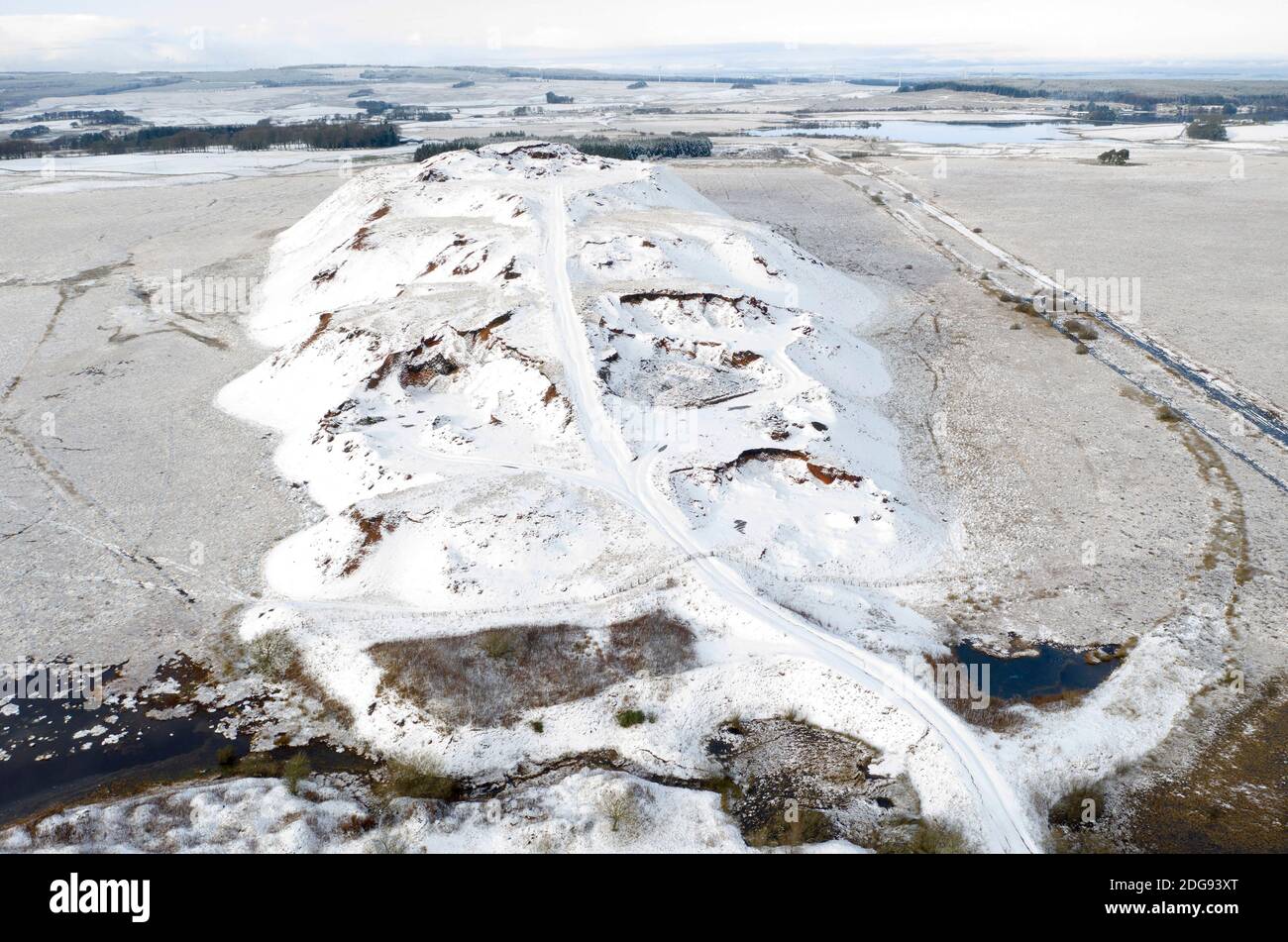Aerial view of Tarbrax shale bing covered in snow, South Lanarkshire, Scotland. Stock Photo