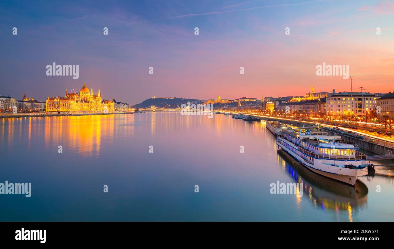 Budapest, Hungary. Panoramic cityscape image of Budapest, capital city of Hungary with Hungarian Parliament Building during beautiful sunset. Stock Photo