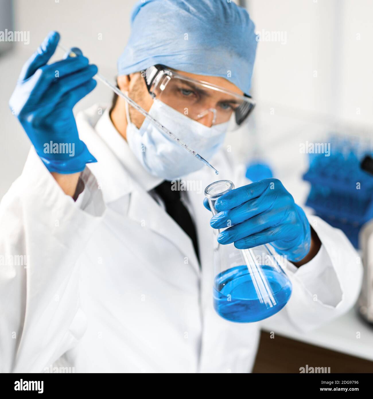 close up. scientist studying the liquid in a medical flask Stock Photo ...