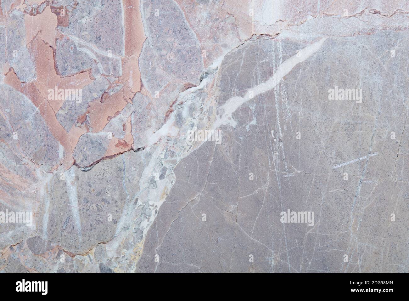 Variegated stone with grey, white and colors texture background with scratches Stock Photo