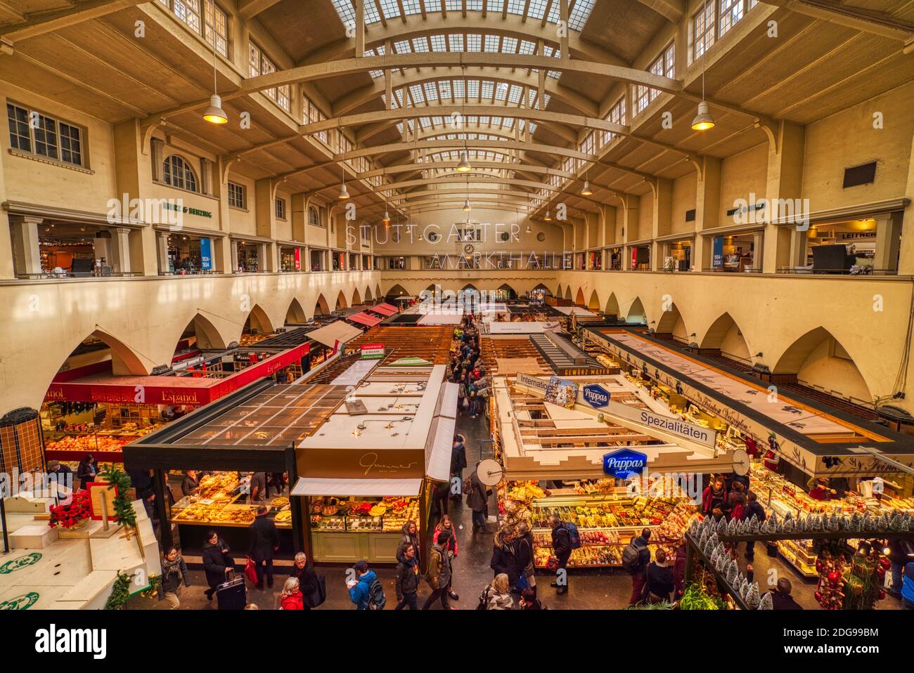 Indoor view of the Stuttgart Markthalle building with its shops and stalls bursting with life. Gourmet food, delicatessen are served at the kiosks Stock Photo
