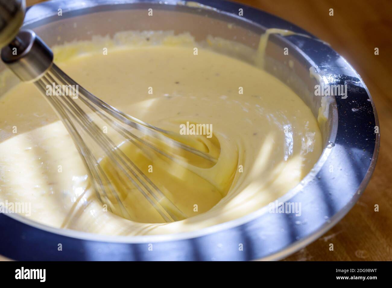 Mixing chocolate and cream. Cream Cake Stock Photo