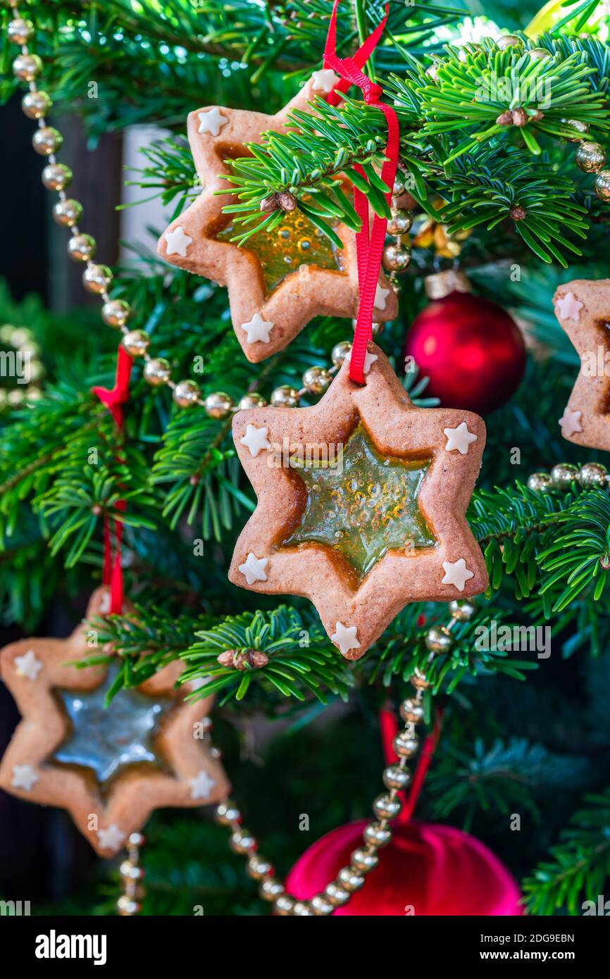 Christmas stained glass window biscuits on a Christmas tree Stock Photo Alamy