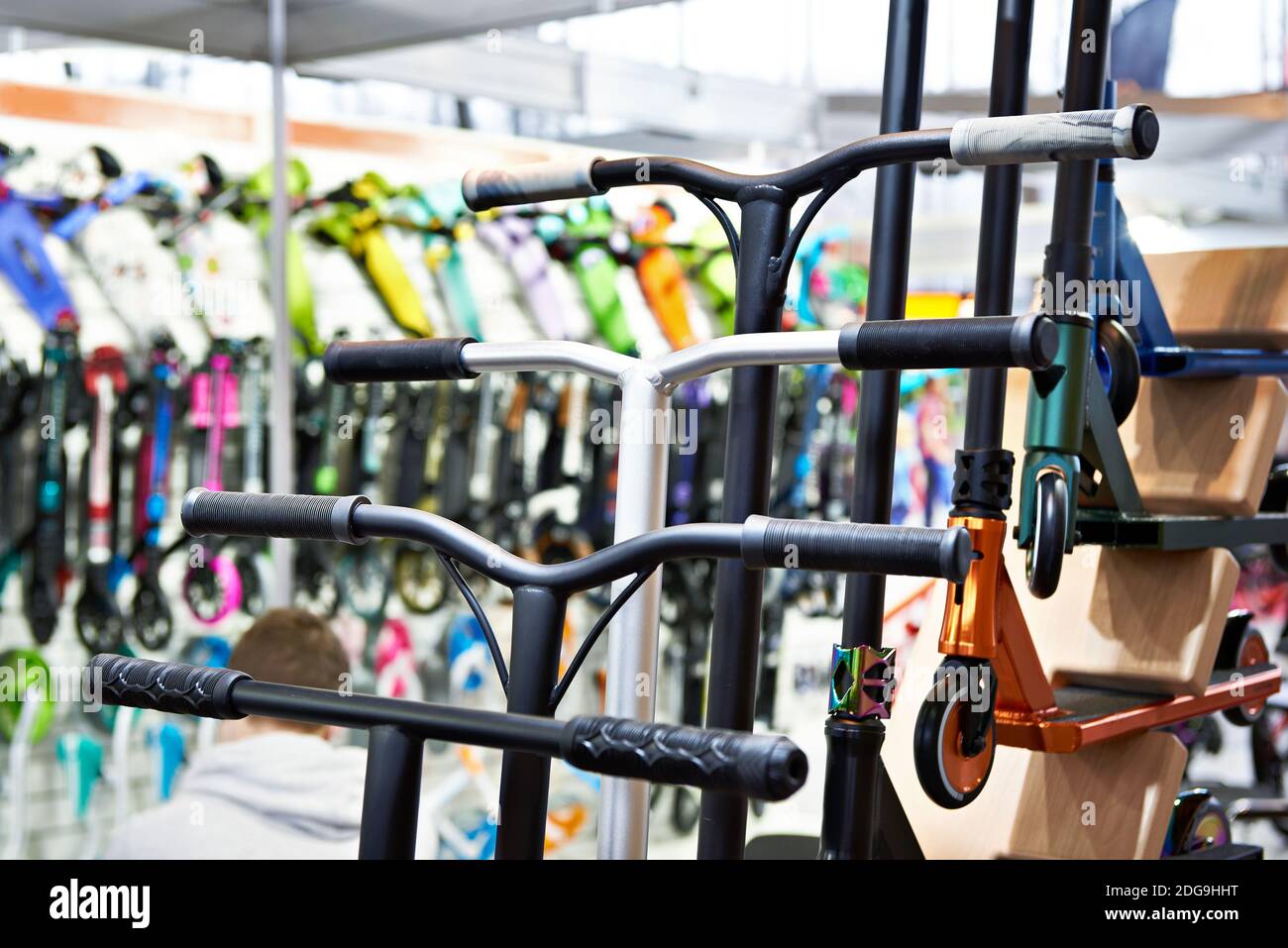 Handlebars of scooters in the store Stock Photo