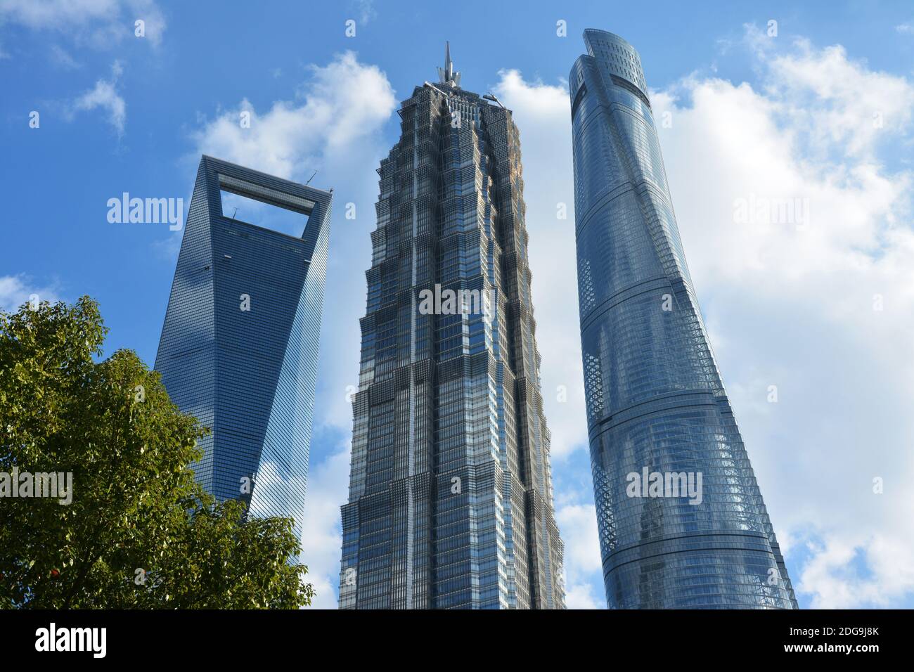 three high skyscrapers under blue sky in sunny day in Lujiazhui of Shanghai Stock Photo
