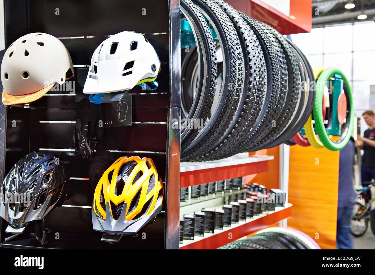 Bicycle helmets and tires in the store Stock Photo Alamy