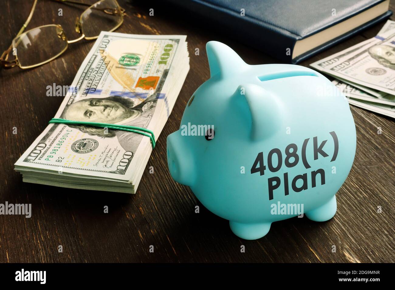 Piggy bank with 408k plan words and cash. Stock Photo