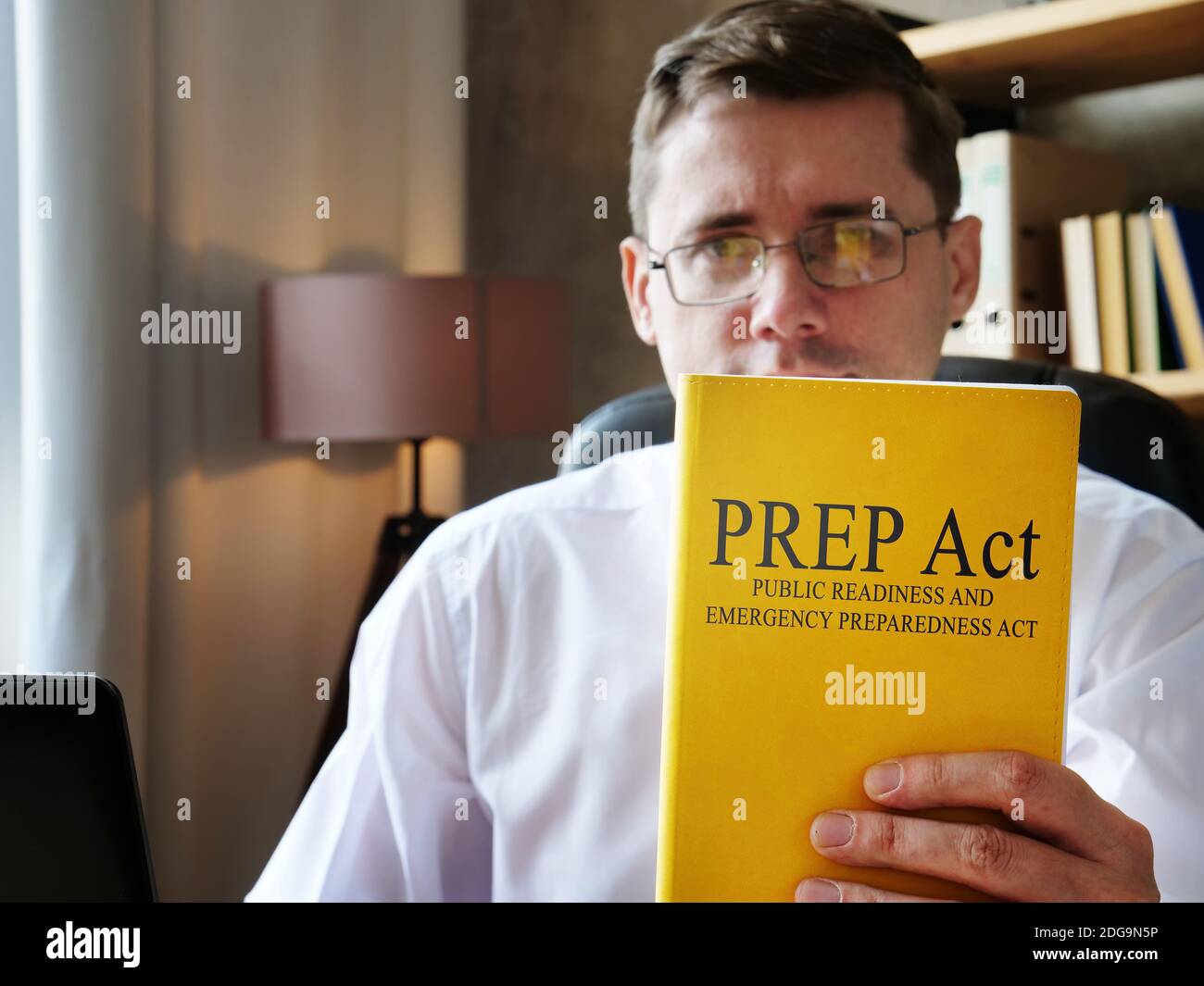 The doctor shows Public Readiness and Emergency Preparedness PREP Act book. Stock Photo