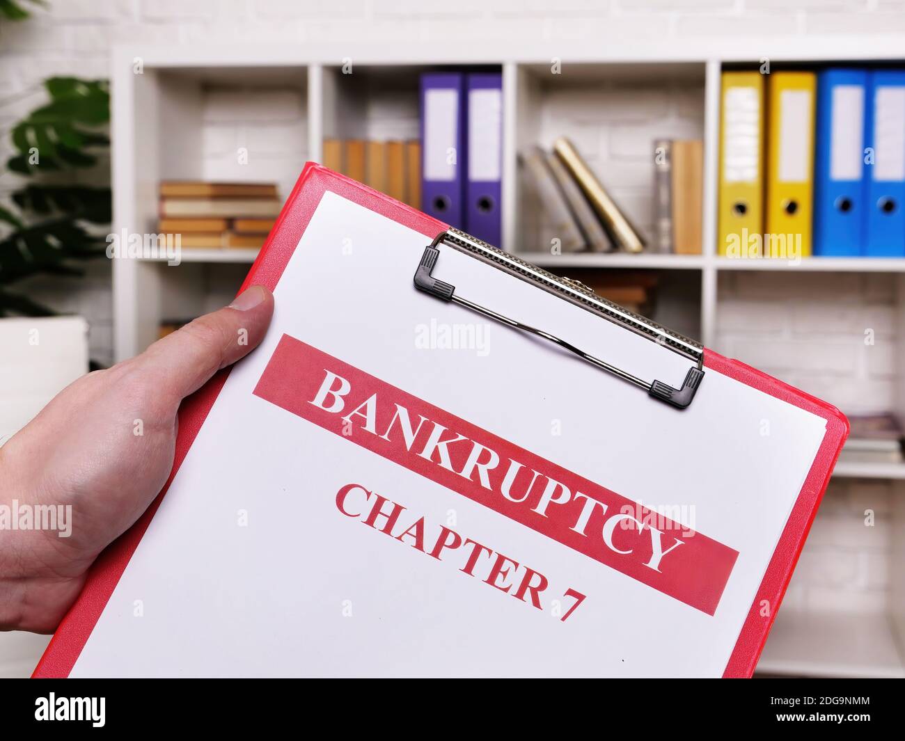 Bankruptcy chapter 7. The manager holds the sheets. Stock Photo