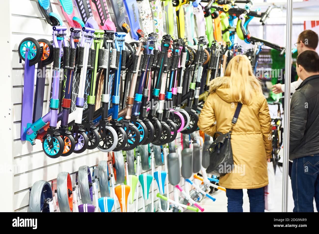 Scooters in store and people buyers Stock Photo