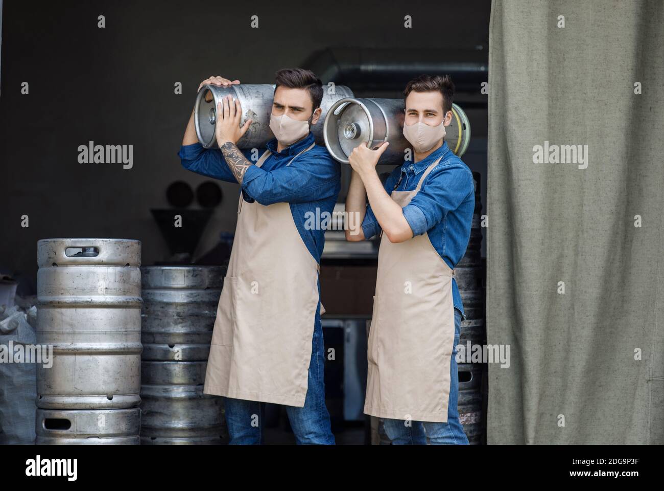 Covid-19 quarantine, work in brewery warehouse for strong man Stock Photo