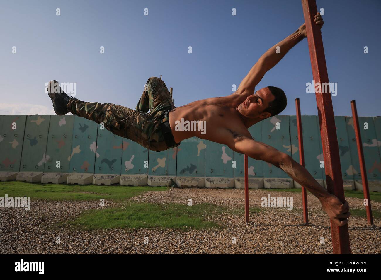 Baghdad, Iraq. 08th Dec, 2020. A soldier shows his skills during a military training by the Iraqi Emergency Response Brigade (ERB) of the Ministry of Interior's Special Operations Forces at a training ground in Baghdad Air base, ahead of the Victory Day that celebrates the defeat of the Islamic State in Iraq. The ERB has played a leading role with the Iraqi military and Kurdish Peshmerga in the battle against the Islamic State (ISIS) in Iraq. Credit: Ameer Al Mohammedaw/dpa/Alamy Live News Stock Photo