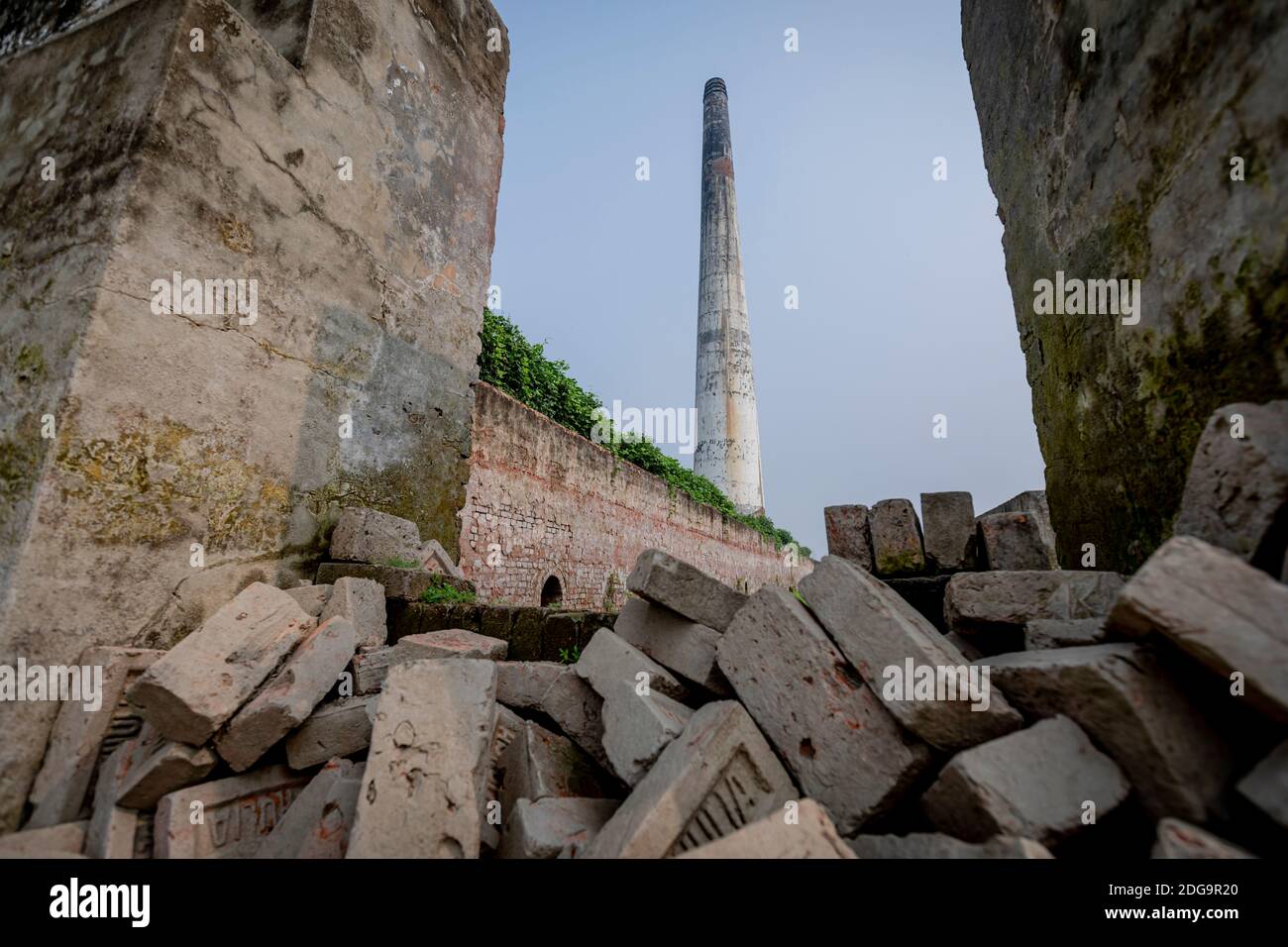 A fixed chimney brick kiln along the hazy Turag river in Ashulia in