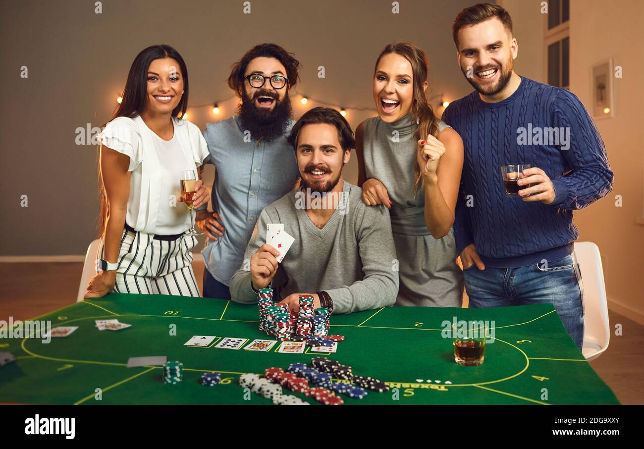Group Of Young Smiling Friends Having Fun With Playing Board Games With Cards And Chips At Home Stock Photo Alamy Group Of Young Smiling Friends Having Fun With Playing Board Games With Cards And Chips At Home Stock Photo Alamy