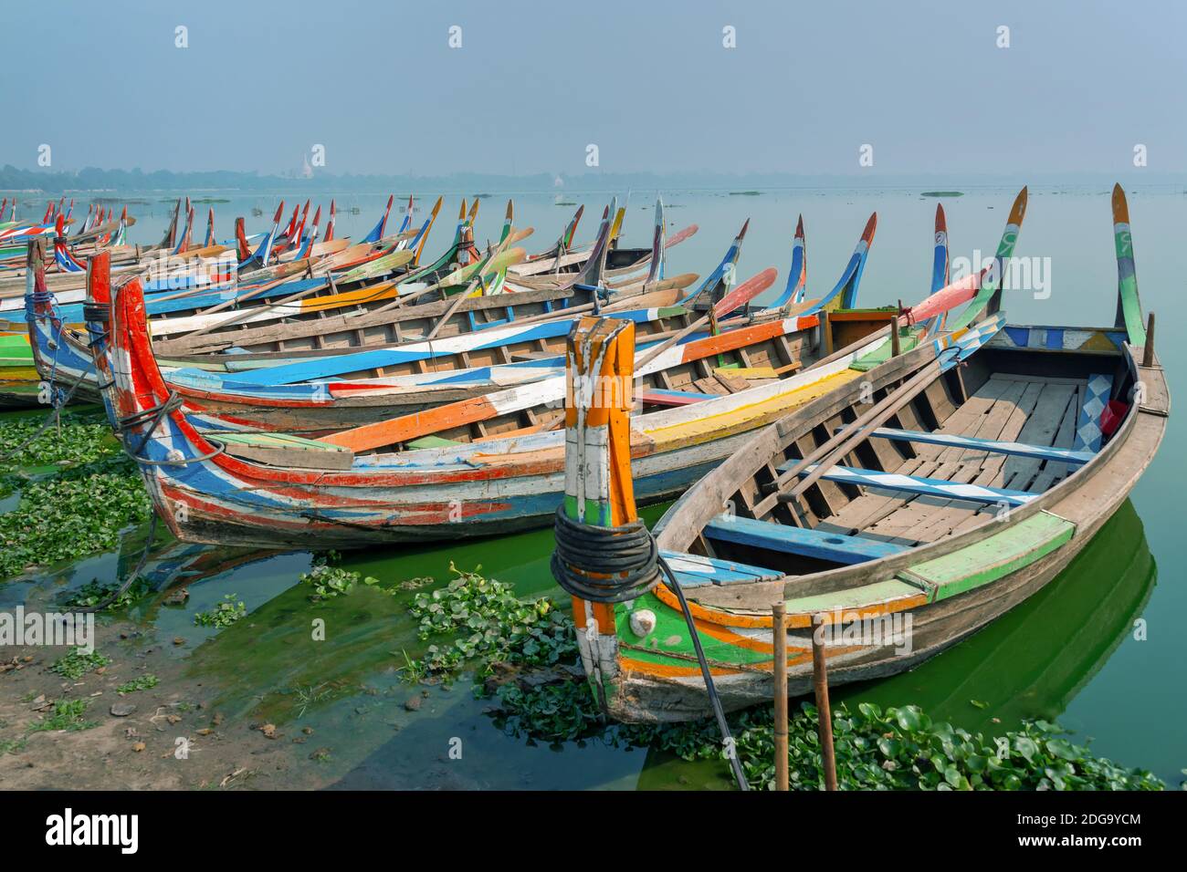 Colorful traditional wooden row boats in Amapura, near U Bein bridge, Mandalay, Burma Myanmar Stock Photo