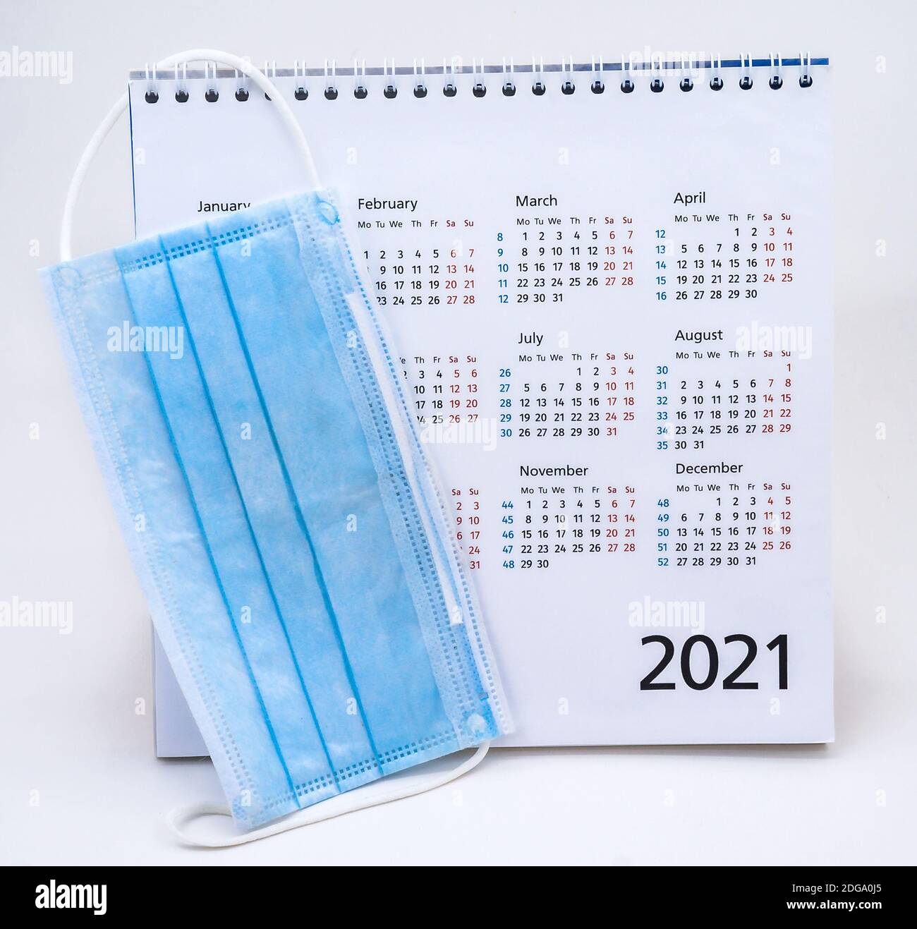 https://c8.alamy.com/comp/2DGA0J5/blue-disposable-mask-on-the-calendar-medical-face-mask-and-calendar-for-2021-2DGA0J5.jpg