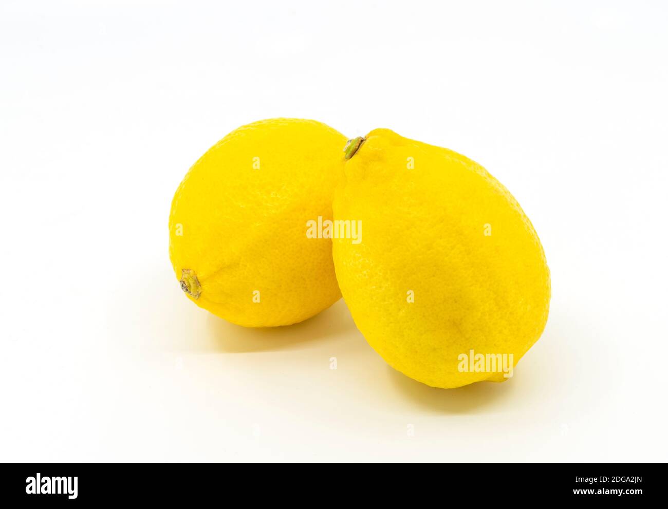 Isolated lime or yellow lemon on white background, two limes are put