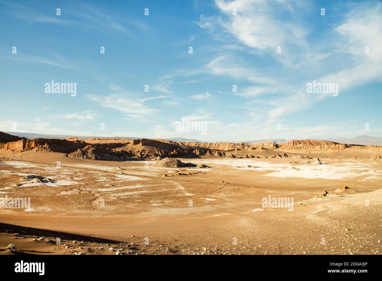 Eroded orange rocks and desert cliffs showing rock strata, in the Valle de la Luna, Valley of the Moon, Atacama Desert, northern Chile Stock Photo