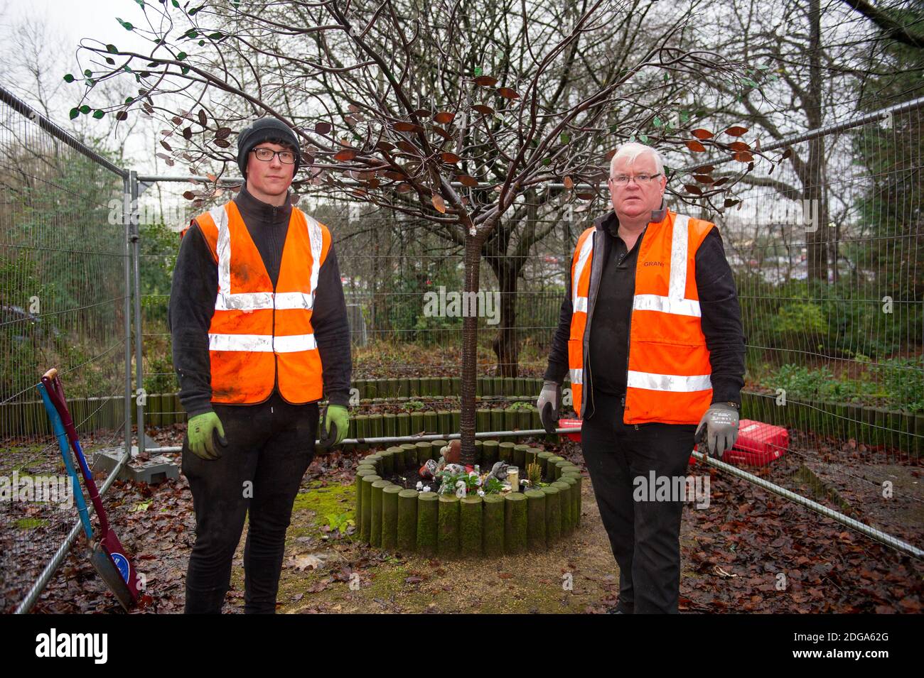Glasgow, Scotland, UK. 8 December 2020. Pictured: (left) Reece Dixon - Health & Safety Lead, and (right) Grant Fitzimmons) CEO of Grant Fitzsimmons & Son Steel Fabricators. SiMBA Charity's Tree Of Tranquility and their ornate bench has been severely vandalised and set fire by vandals leaving their cigarette lighter behind. Distraught and bereaved Parents, Kat and Fraser made the horrific discovery as they visited SiMBA's memorial garden. Credit Colin Fisher/Alamy Live News. Stock Photo