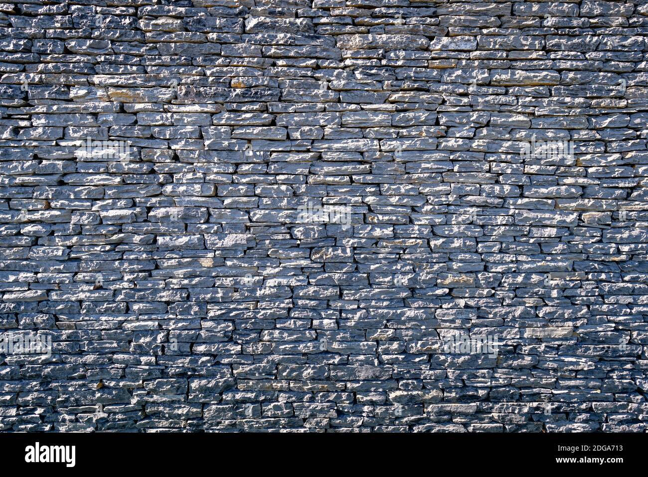 stone wall surface, Black brick wall texture, brick surface for background. Vintage wallpaper. Stock Photo