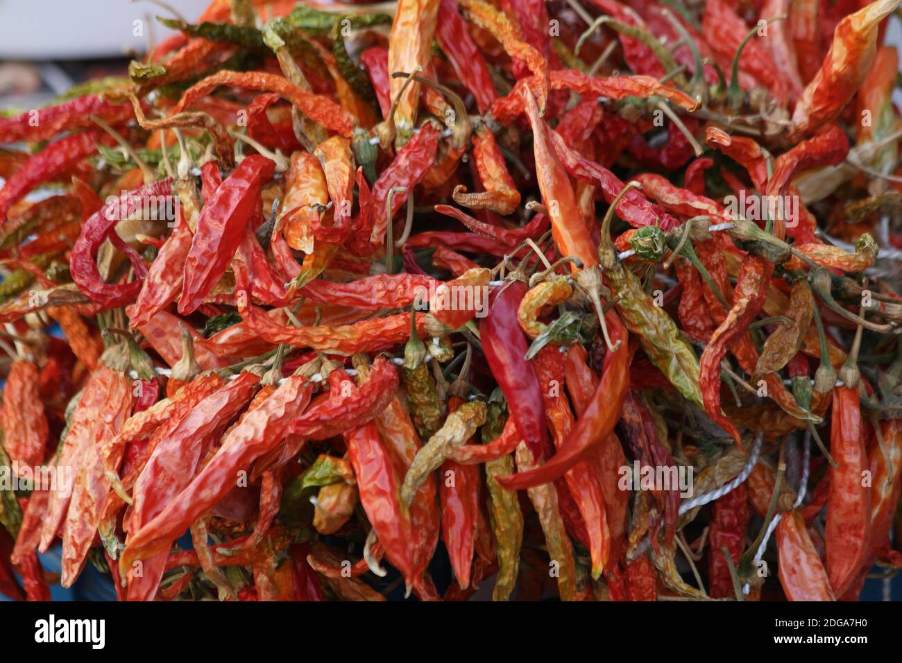 Dried red chili peppers background Stock Photo - Alamy