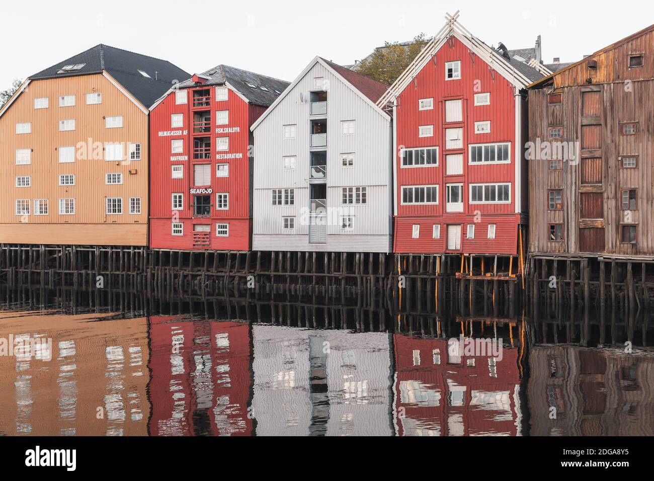 Trondheim, Norway - October 18, 2016: Colorful wooden houses in old town of Trondheim. Coast of Nidelva river Stock Photo