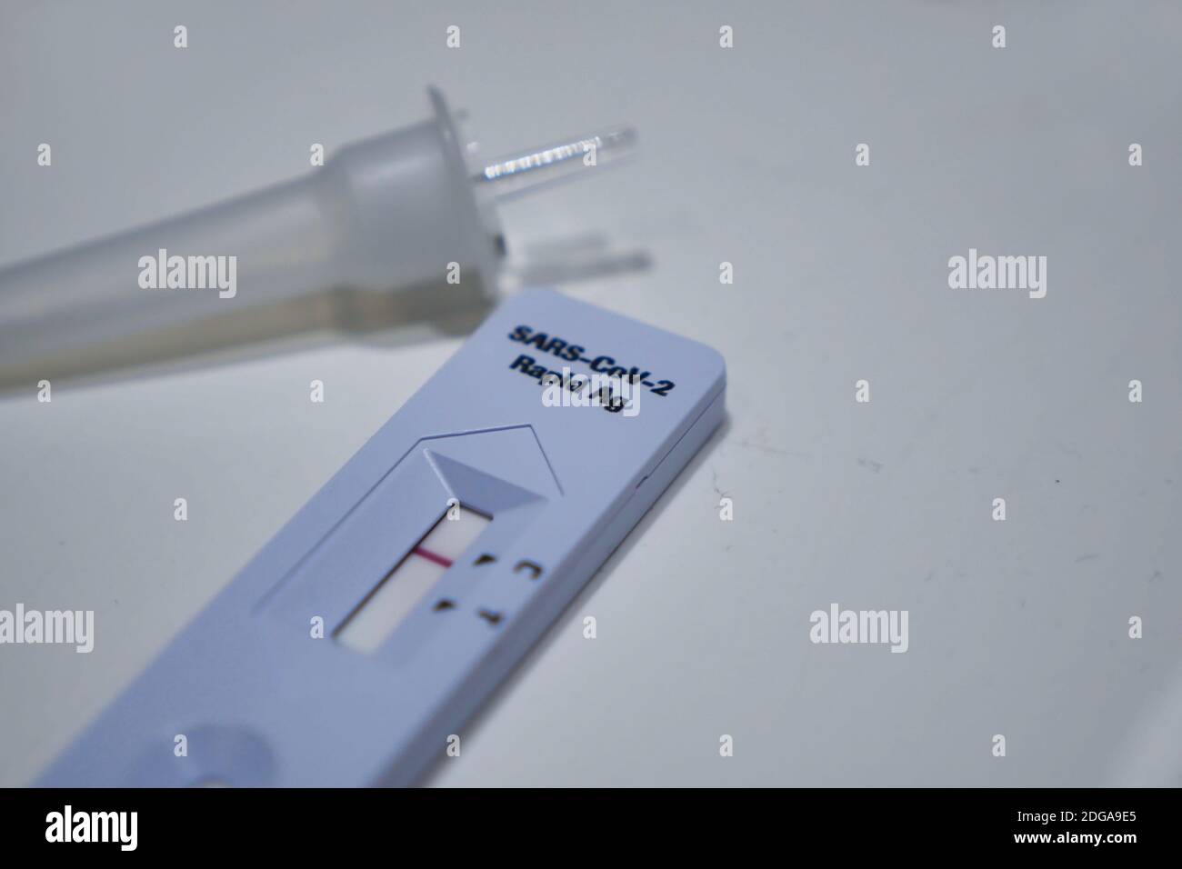 Covid-19 antigen test device on table surface. High angle view. Stock Photo