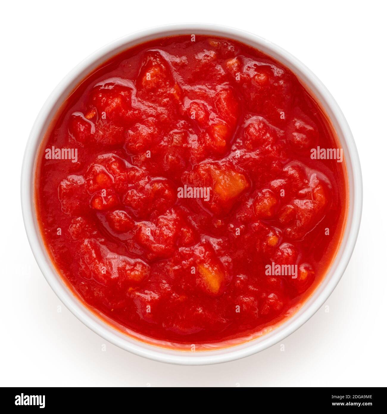 Tinned chopped tomatoes in a white ceramic bowl isolated on white. Top
