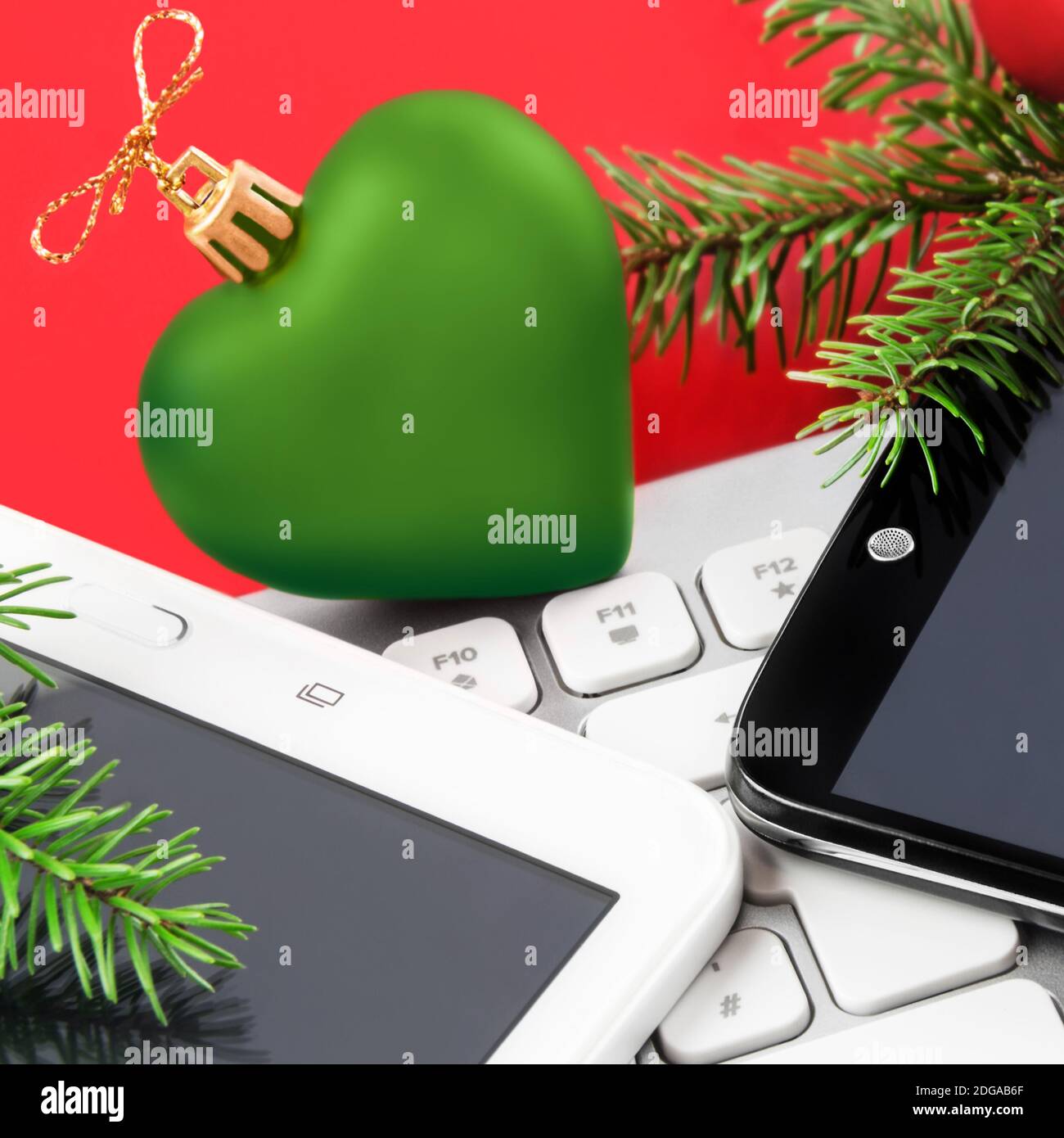 Christmas Time with mobile, PC keyboard and tablet Stock Photo