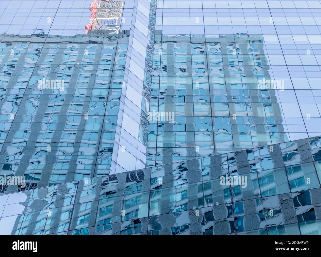 Reflections in the glass facade of a skyscaper in Midtown, Manhattan, NY Stock Photo