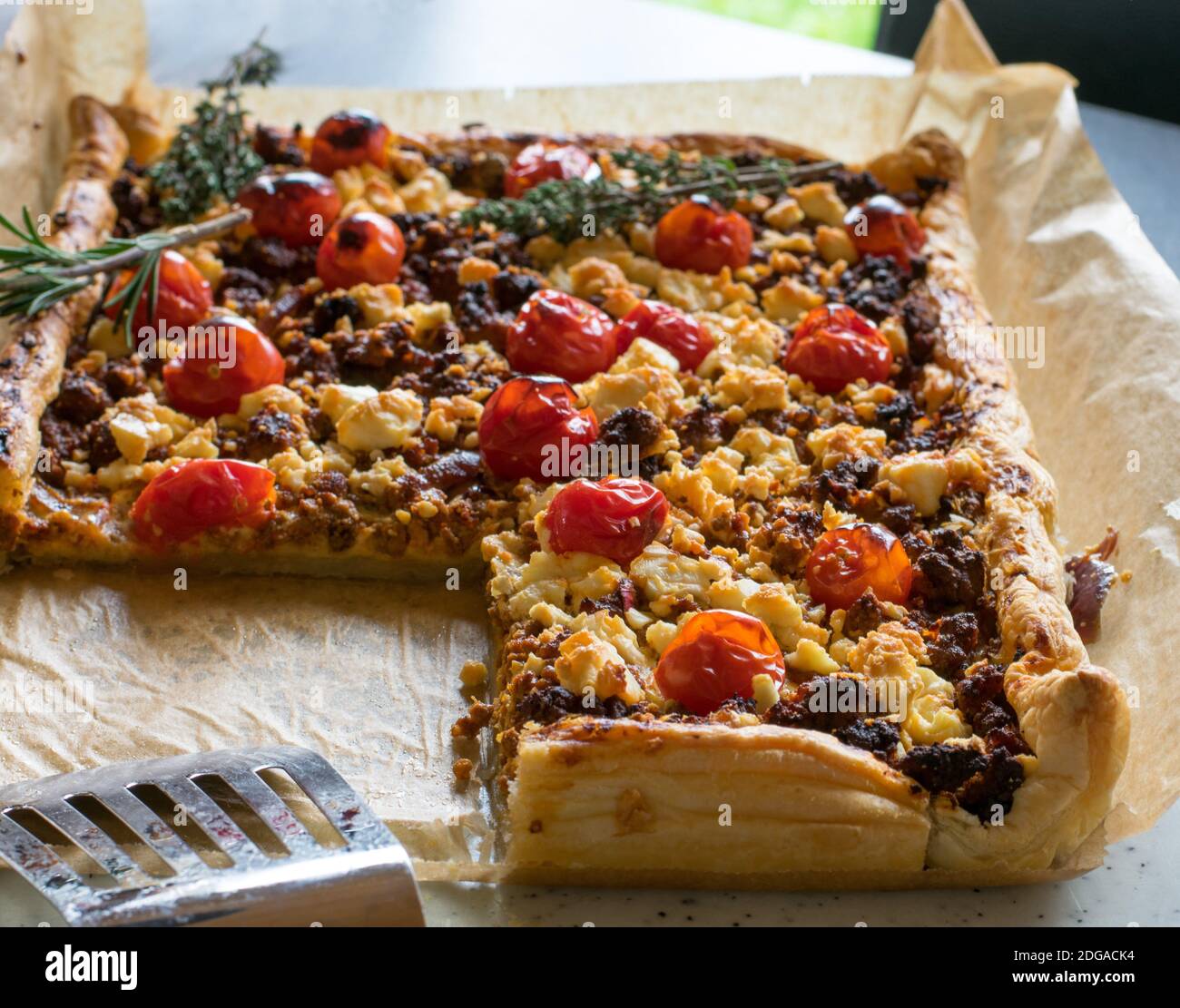 puff pastry, minced meat, tomatoes and feta cheese oven baked meal Stock  Photo - Alamy