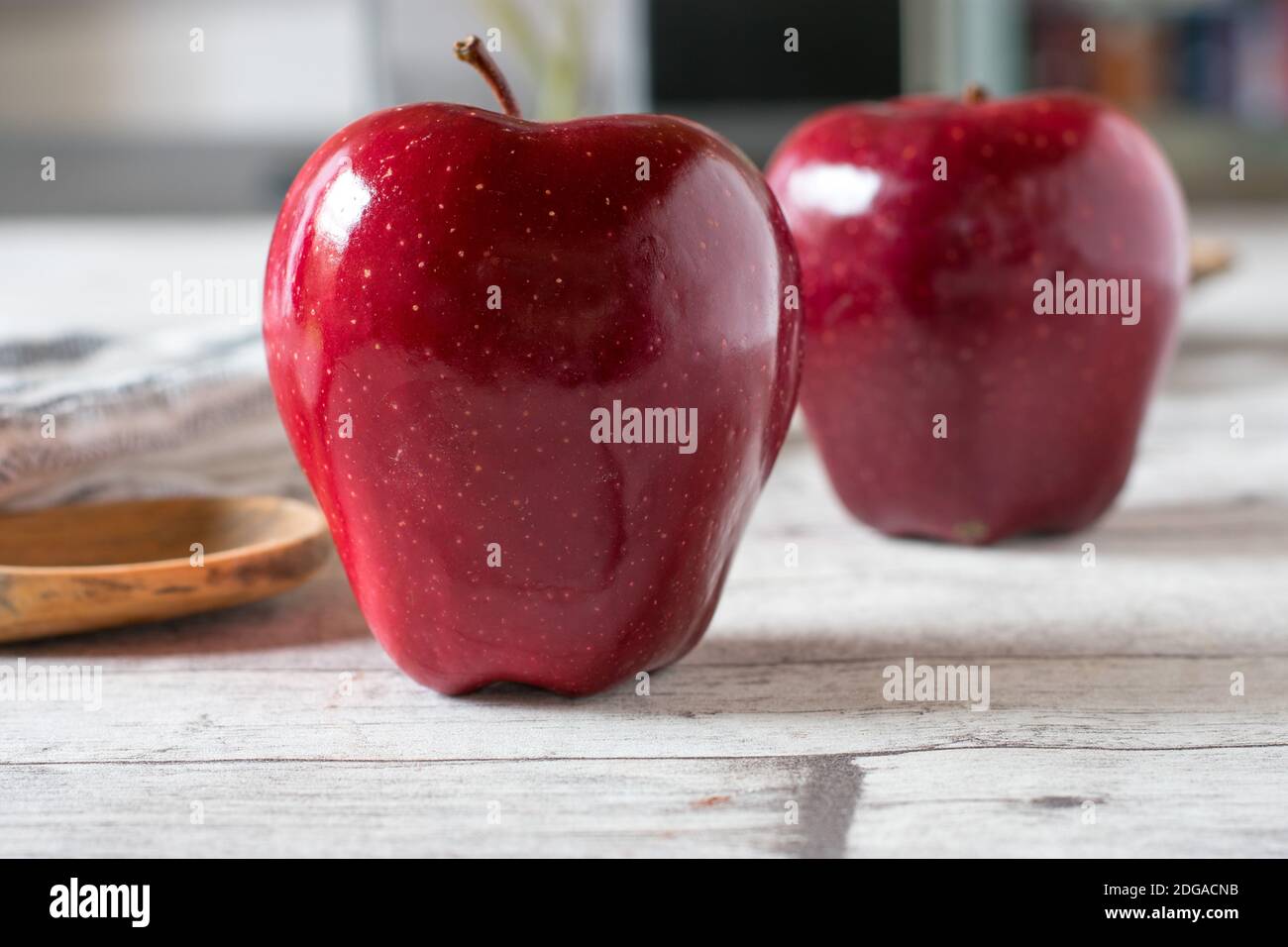 beautiful red apple on white kitchen table background Stock Photo