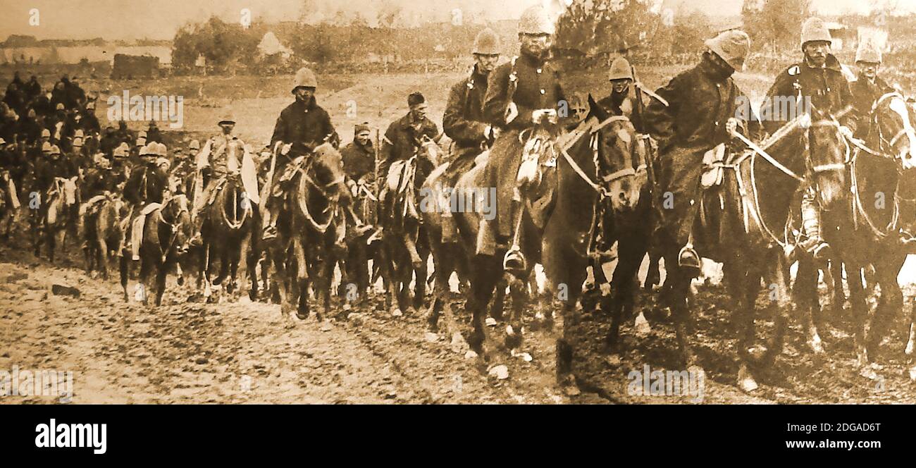An old photograph showing British mounted cavalry / infantry troops engaged in the Boer War. Lord Roberts ordered all British  battalions  to provide a mounted infantry company on arrival.  The mounted infantry was comprised of men equipped and trained as infantry, armed with the infantry rifle (i.e. not the cavalry carbine). This particular group appear battle weary  with a soldier at the front nearly asleep. Stock Photo