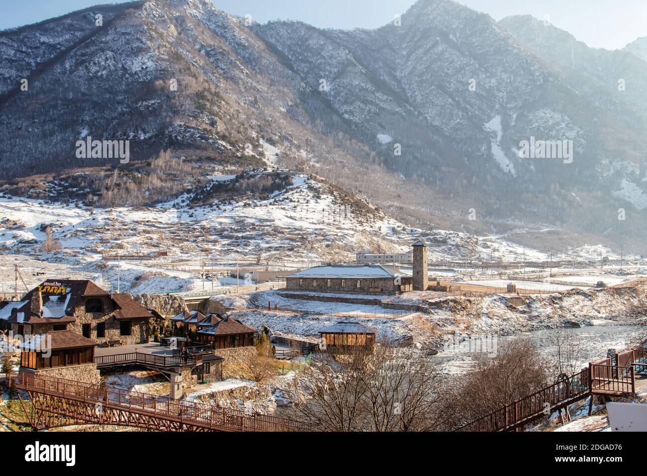 View of the village with cafes and hotels located in the mountain tourist center near the ruins of a Stock Photo
