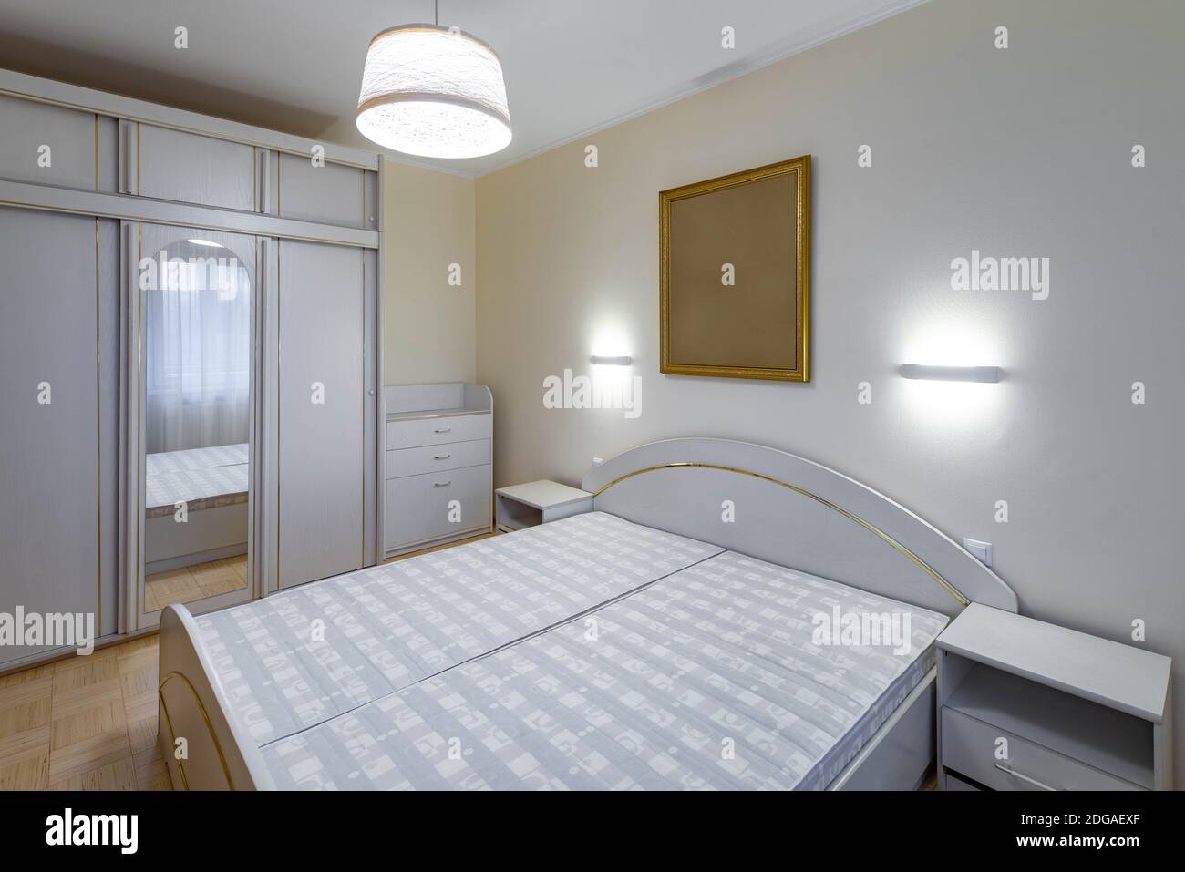 Modern Interior Of Bedroom In Apartment Sliding Door Wardrobe With Mirror White Dresser Bed And Nightstands Stock Photo Alamy