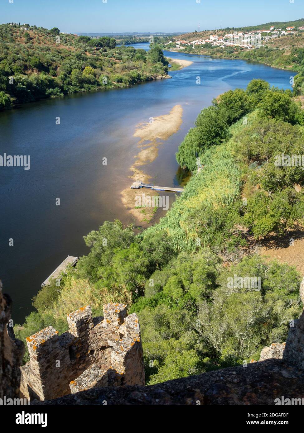 View of Tagus River and Tancos village from the top of Almorol Castle tower with it's battlements Stock Photo