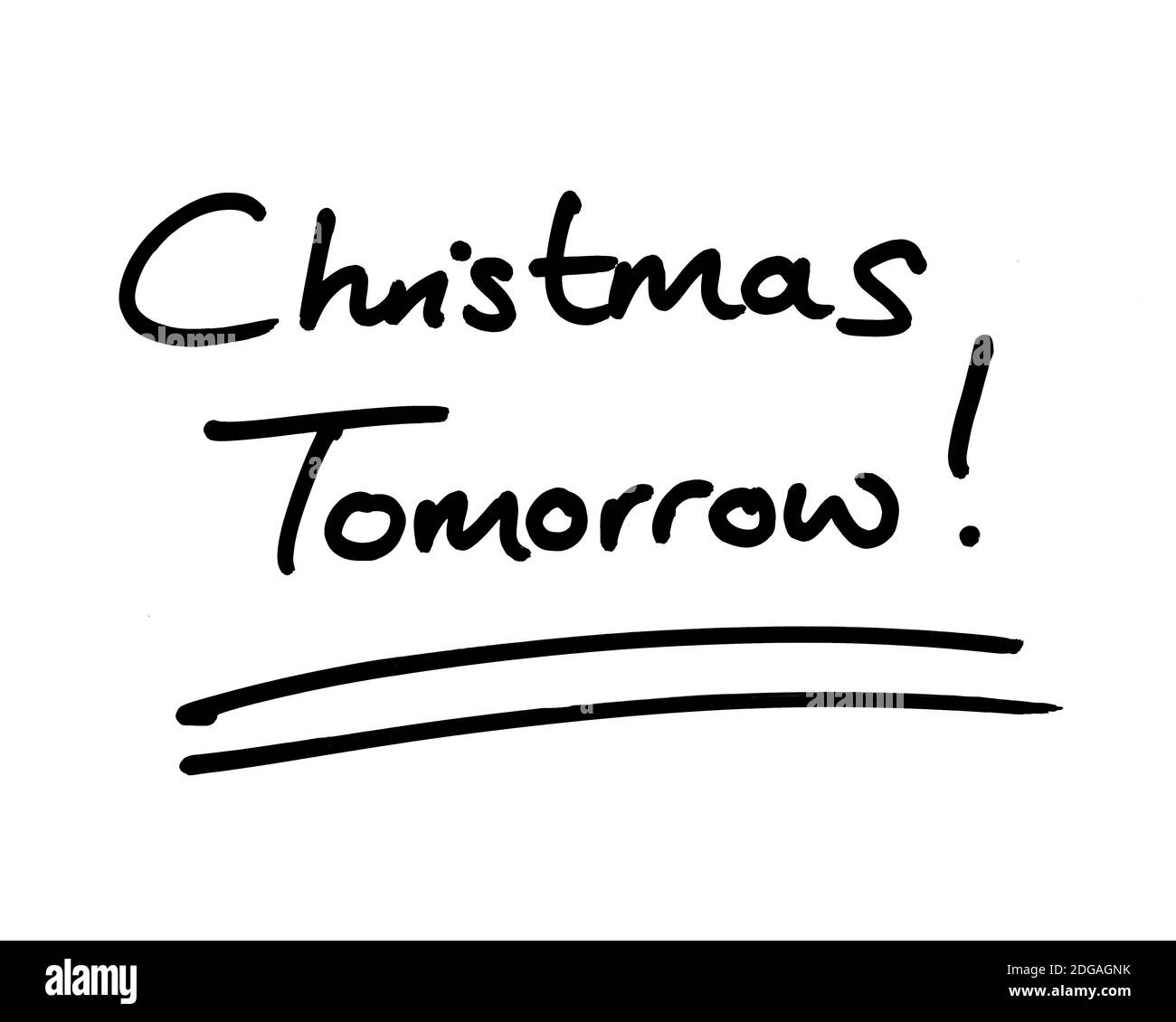 Christmas Tomorrow! handwritten on a white background. Stock Photo