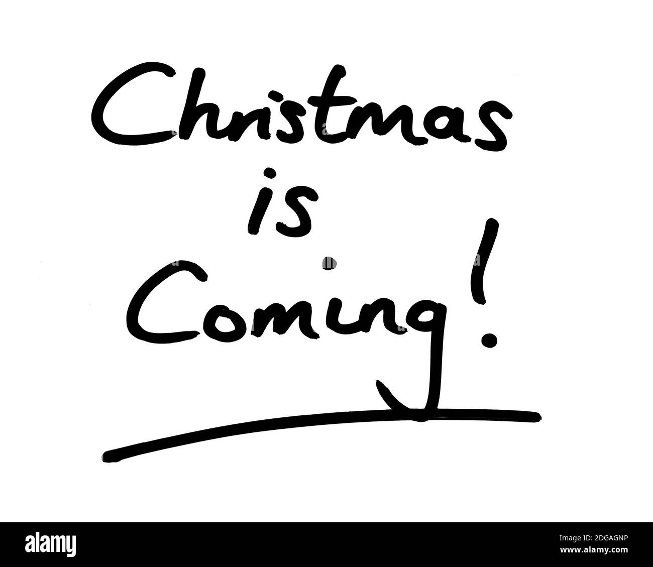 Christmas is Coming! handwritten on a white background. Stock Photo