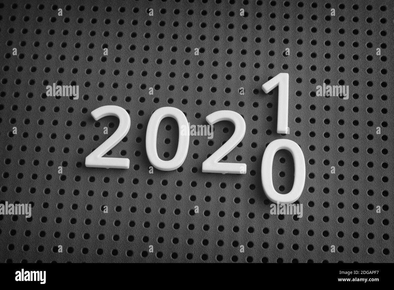 The year 2020 turning into the year 2021. Black and white image. Close up. Stock Photo