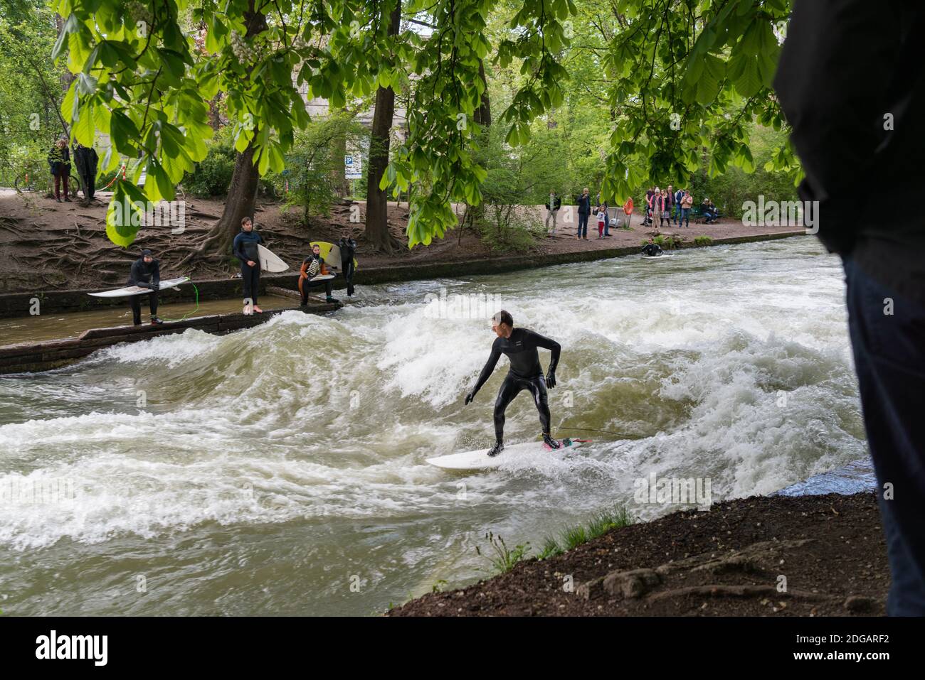 Surfing in the river Eisbach, Munich, Germany Stock Photo